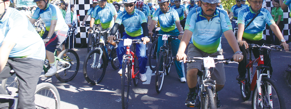 People on bicycles and taking part in races.